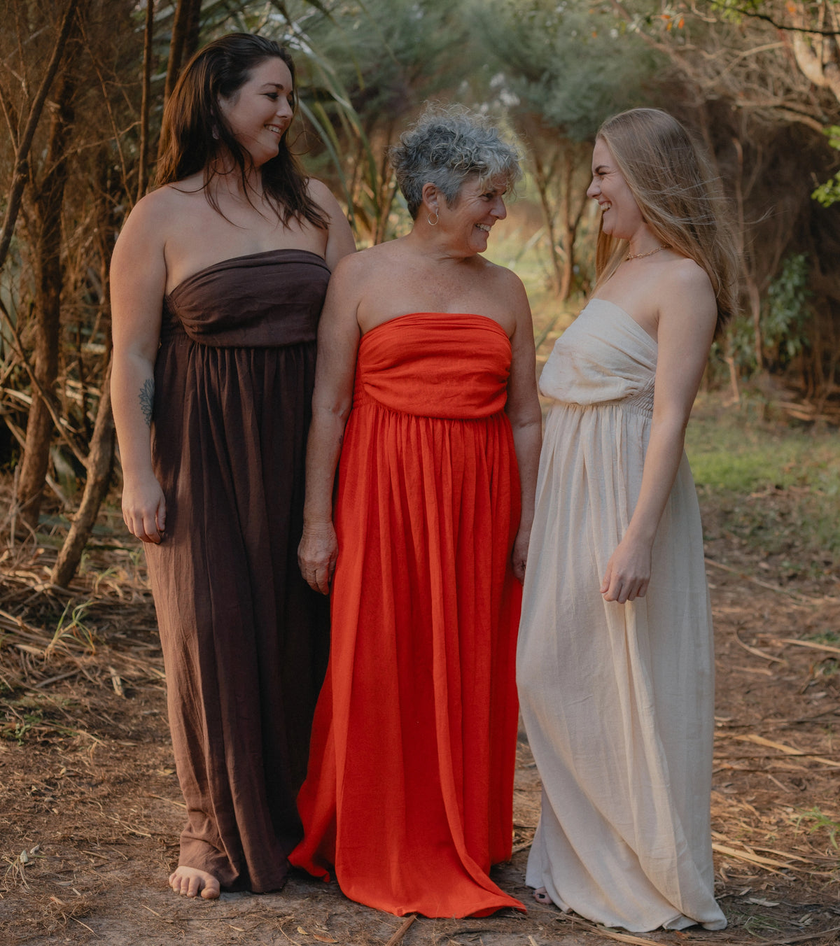 mother and daughters wearing dresses